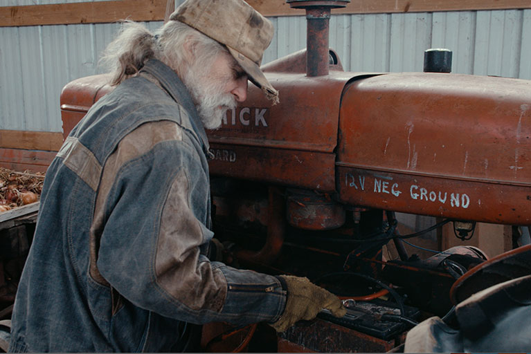 A man working on a tractor.