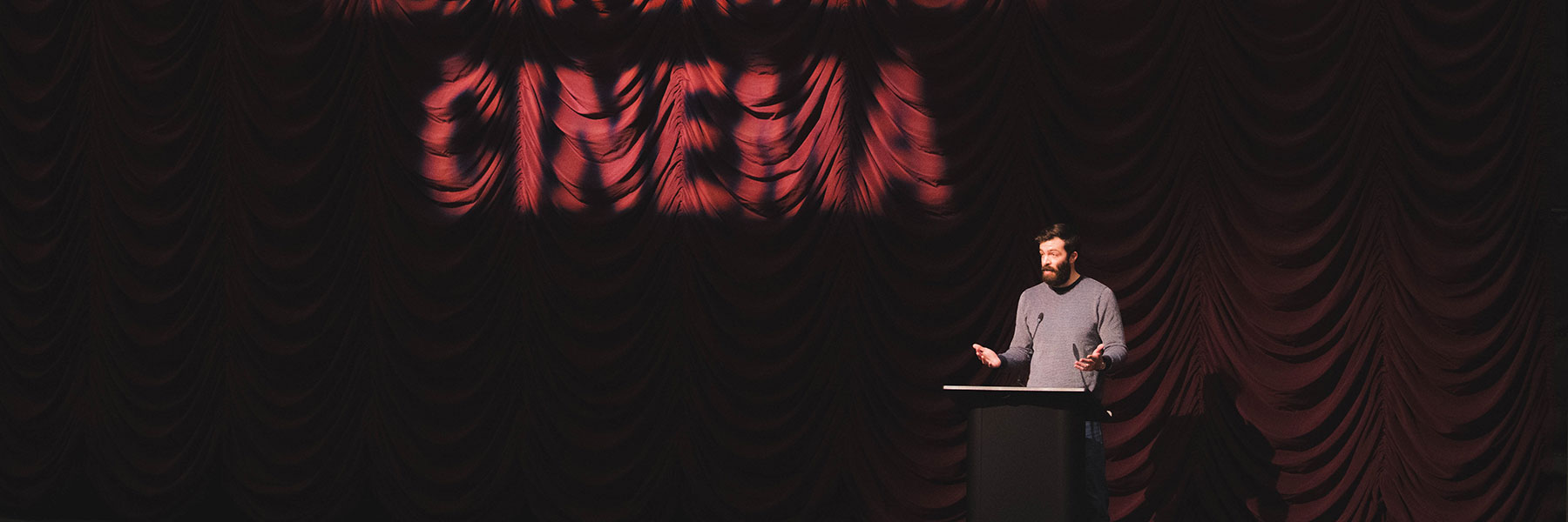 Caleb Allison speaking on the IU Cinema stage