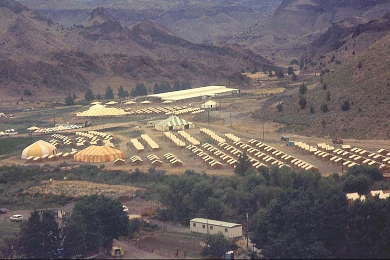 An aerial view of a commune in the mountains.